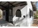 White barn with arched windows and metal roof at 22770 Skyview Cir, Brooksville, FL 34602