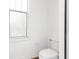 Simple bathroom with toilet and window at 22770 Skyview Cir, Brooksville, FL 34602