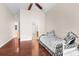 Hardwood floor bedroom with daybed and access to bath at 22770 Skyview Cir, Brooksville, FL 34602