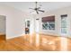 Bright bedroom with hardwood floors and access to a balcony at 22770 Skyview Cir, Brooksville, FL 34602