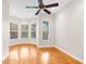 Bright bedroom with hardwood floors and a ceiling fan at 22770 Skyview Cir, Brooksville, FL 34602