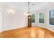 Spacious dining room with hardwood floors and chandelier at 22770 Skyview Cir, Brooksville, FL 34602