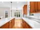 Kitchen with center island, wood cabinets, and white countertops at 22770 Skyview Cir, Brooksville, FL 34602