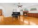 Living room with hardwood floors, fireplace, and grand piano at 22770 Skyview Cir, Brooksville, FL 34602