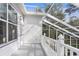 Screened porch with white railing overlooking backyard at 22770 Skyview Cir, Brooksville, FL 34602