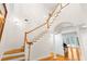Elegant staircase with wooden banister and hardwood floors at 22770 Skyview Cir, Brooksville, FL 34602