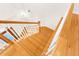 Wooden staircase with white railings at 22770 Skyview Cir, Brooksville, FL 34602