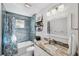 Clean bathroom with granite countertop, updated fixtures, and a bathtub at 3215 Rose Arbor Dr, Hernando Beach, FL 34607