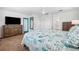 Main bedroom with ensuite bathroom and large TV at 3215 Rose Arbor Dr, Hernando Beach, FL 34607