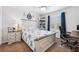 Bedroom with a queen-size bed, built-in shelves, and a workspace at 3215 Rose Arbor Dr, Hernando Beach, FL 34607