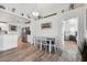 Bright dining room with wood table and access to a bedroom at 3215 Rose Arbor Dr, Hernando Beach, FL 34607