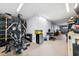 Home gym with weight machine and storage; great workout space at 3215 Rose Arbor Dr, Hernando Beach, FL 34607