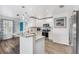 Modern kitchen with white cabinets, granite countertops and stainless steel appliances at 3215 Rose Arbor Dr, Hernando Beach, FL 34607