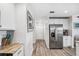 Kitchen with stainless steel refrigerator and granite countertop at 3215 Rose Arbor Dr, Hernando Beach, FL 34607