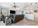 Open living area with hardwood floors, leather couches, and a teal accent wall at 3215 Rose Arbor Dr, Hernando Beach, FL 34607