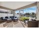 Screened patio with canal view; comfortable seating area at 3215 Rose Arbor Dr, Hernando Beach, FL 34607