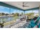 Large screened porch with water views and comfortable seating at 3215 Rose Arbor Dr, Hernando Beach, FL 34607