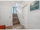 Well-lit staircase leading to the upper level of the home at 3215 Rose Arbor Dr, Hernando Beach, FL 34607