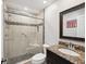 Clean bathroom with granite countertop, single sink, and shower/tub combo at 3259 Hilary Cir # 1C, Palm Harbor, FL 34684