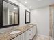 Updated bathroom with granite countertops, double sinks, and walk-in shower at 3259 Hilary Cir # 1C, Palm Harbor, FL 34684