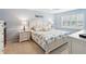 Bright bedroom with a king-size bed and coastal decor at 3259 Hilary Cir # 1C, Palm Harbor, FL 34684
