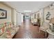 Inviting community hallway with brick flooring and comfortable seating at 3259 Hilary Cir # 1C, Palm Harbor, FL 34684