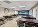 Large conference room with multiple tables and chairs, ideal for meetings at 3259 Hilary Cir # 1C, Palm Harbor, FL 34684