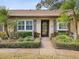 House exterior with landscaped yard and walkway at 3259 Hilary Cir # 1C, Palm Harbor, FL 34684