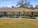 Three-unit building with appealing landscaping and inviting entrance at 3259 Hilary Cir # 1C, Palm Harbor, FL 34684