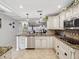 Open kitchen with island and stainless steel appliances at 3259 Hilary Cir # 1C, Palm Harbor, FL 34684