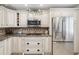 Kitchen boasts granite countertops, stainless steel appliances, and ample cabinet space at 3259 Hilary Cir # 1C, Palm Harbor, FL 34684