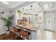 Kitchen boasts granite counters and breakfast bar at 3259 Hilary Cir # 1C, Palm Harbor, FL 34684