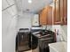 Laundry room with washer, dryer, and overhead shelving at 3259 Hilary Cir # 1C, Palm Harbor, FL 34684