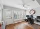 Home office with a desk, two computer monitors, and wood flooring at 3259 Hilary Cir # 1C, Palm Harbor, FL 34684
