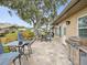 Outdoor patio with seating area and a built-in grill at 3259 Hilary Cir # 1C, Palm Harbor, FL 34684