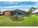 Landscaped backyard with screened pool at 3414 Graycliff Ln, Brandon, FL 33511