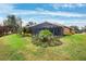 Landscaped backyard with screened pool at 3414 Graycliff Ln, Brandon, FL 33511