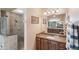 Bathroom with granite countertop, large mirror and walk-in shower at 3414 Graycliff Ln, Brandon, FL 33511