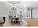 Formal dining room with chandelier and large window at 3414 Graycliff Ln, Brandon, FL 33511