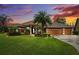 Home with three-car garage at sunset at 3414 Graycliff Ln, Brandon, FL 33511
