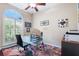 Home office with glass desk and large window at 3414 Graycliff Ln, Brandon, FL 33511