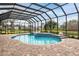Inviting pool and patio area with a screened enclosure at 3414 Graycliff Ln, Brandon, FL 33511