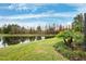Serene waterfront view with lush landscape at 3414 Graycliff Ln, Brandon, FL 33511