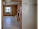 Living room with wood paneling, tile floor and fireplace at 3419 Van Nuys Loop, New Port Richey, FL 34655