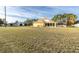 Large backyard with house and screened patio visible in the background at 4332 Lamson Ave, Spring Hill, FL 34608