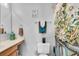 Guest bathroom with a floral shower curtain and vanity at 4332 Lamson Ave, Spring Hill, FL 34608