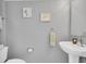 Simple bathroom with sink, toilet and tasteful decor at 4332 Lamson Ave, Spring Hill, FL 34608