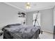 Guest bedroom with a full-size bed and exercise equipment at 4332 Lamson Ave, Spring Hill, FL 34608