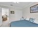 Bedroom with a large bed, built-in closet and view of living area at 4332 Lamson Ave, Spring Hill, FL 34608
