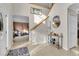Spacious entryway with staircase, tile flooring, and a seating area at 4332 Lamson Ave, Spring Hill, FL 34608